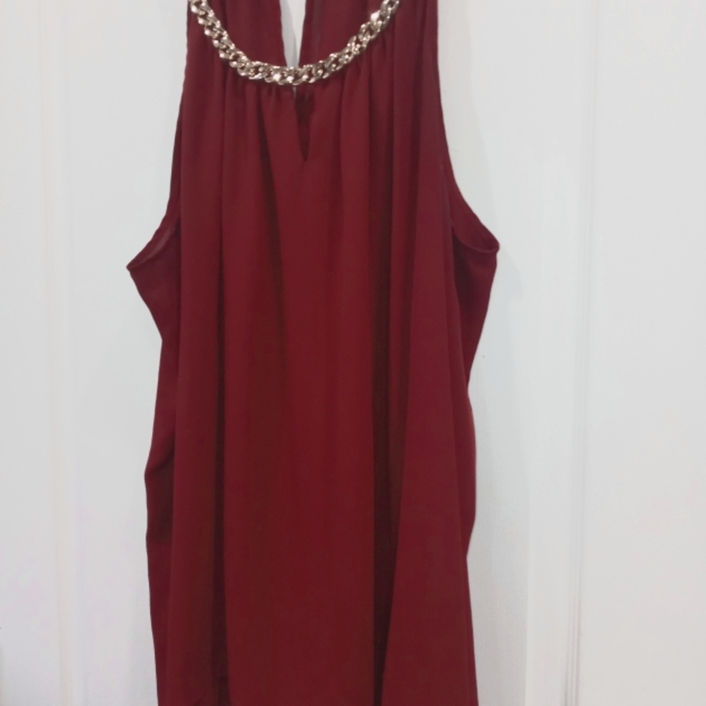 Plus size (3x) burgundy halter tank with bold gold link chain around neckline.